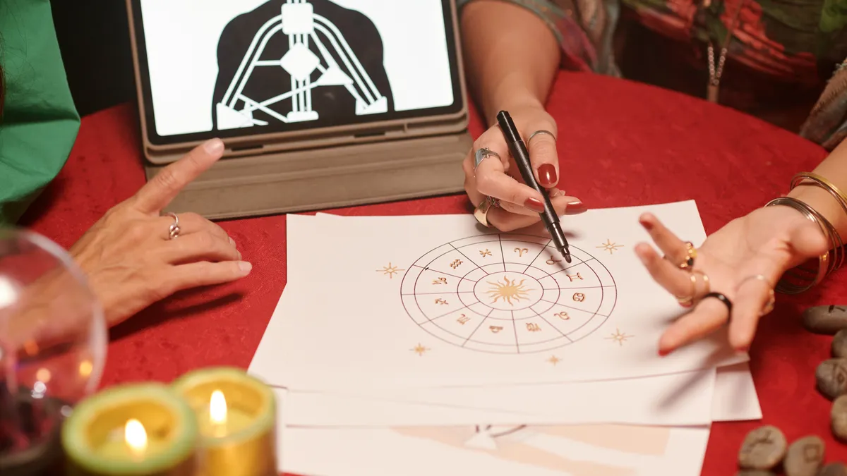 composite chart: hands drawing astrology chart illustration for this article